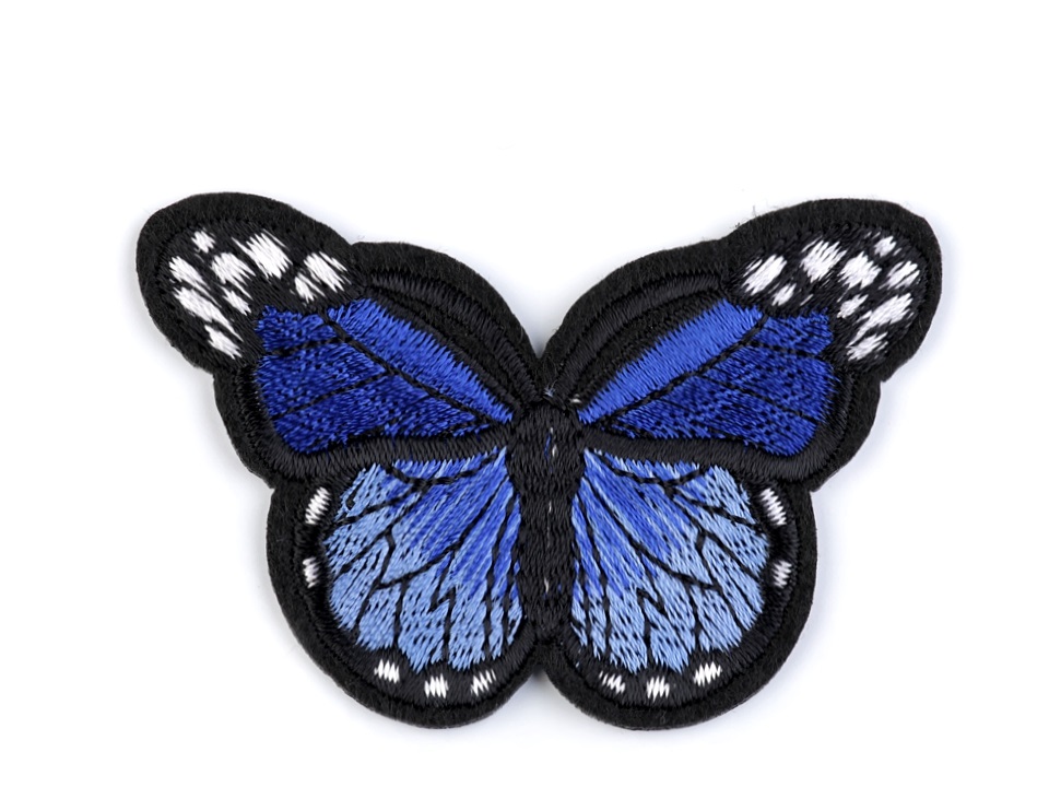 Nažehlovačka - motýľ tmavomodrý